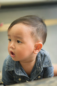 Portrait of cute baby girl looking away