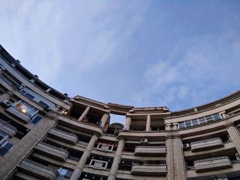 Low angle view of buildings against blue sky