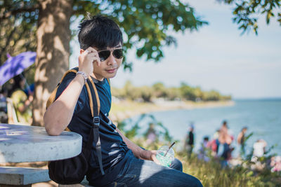 Portrait of young man wearing sunglasses