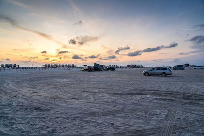 Scenic view of beach against sky during sunset