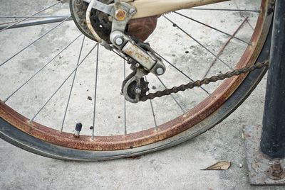 Cropped image of old bicycle with flat tire