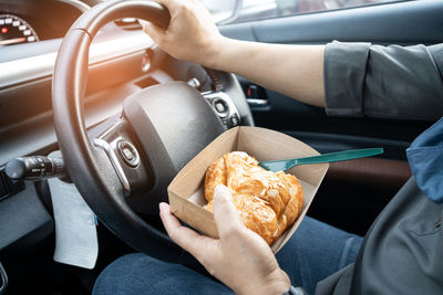 Midsection of person having food