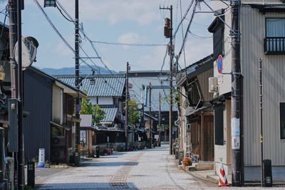 Street amidst buildings against sky