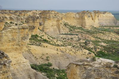 Scenic view of rock formations against sky