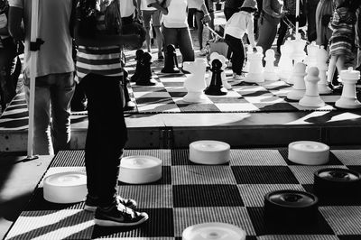 Low section of people walking on street