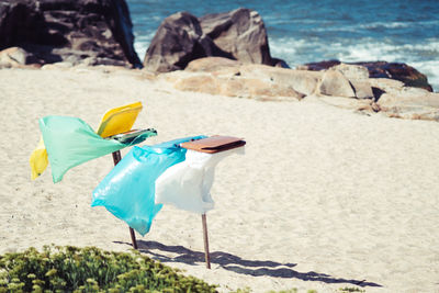 Garbage bags at beach during summer