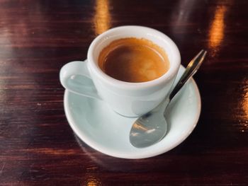 High angle view of coffee cup on table