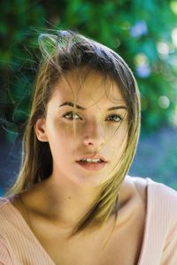 Close-up portrait of a serious young woman