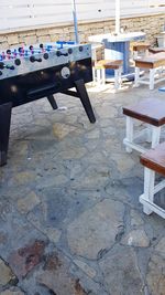 Close-up of chairs on table