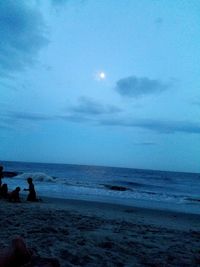 Scenic view of calm sea against cloudy sky