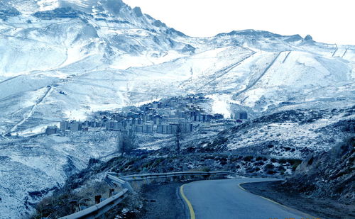 Close-up of snow covered mountain against sky