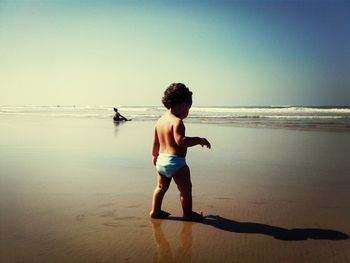WOMAN ENJOYING AT BEACH