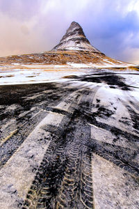 Scenic view of frozen lake against sky