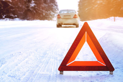 Information sign on snow covered road