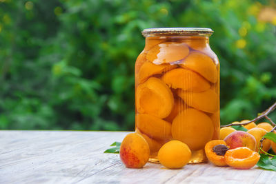 Close-up of fruits in jar on table