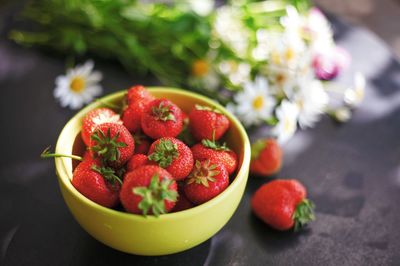 Close-up of strawberries in bowl on table