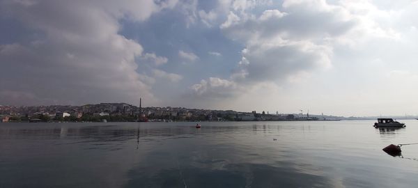 Panoramic view of sea against sky in city