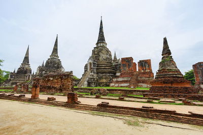 View of old temple building against sky