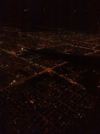 Aerial view of illuminated city at night