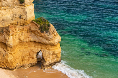 High angle view of rock formation on sea