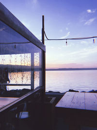 Scenic view of sea against sky seen through window