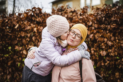 Full length of mother and daughter during autumn