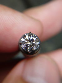 Close-up of jeweler holding diamond