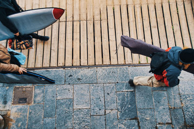 Low section of men on footpath