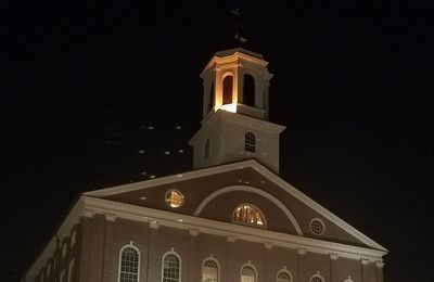 Low angle view of bell tower against sky at night