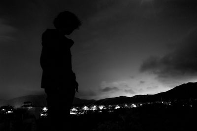Silhouette of man at night