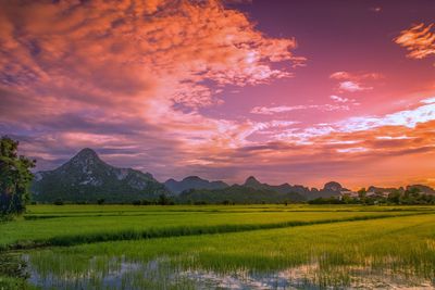 Scenic view of lake against sky during sunset