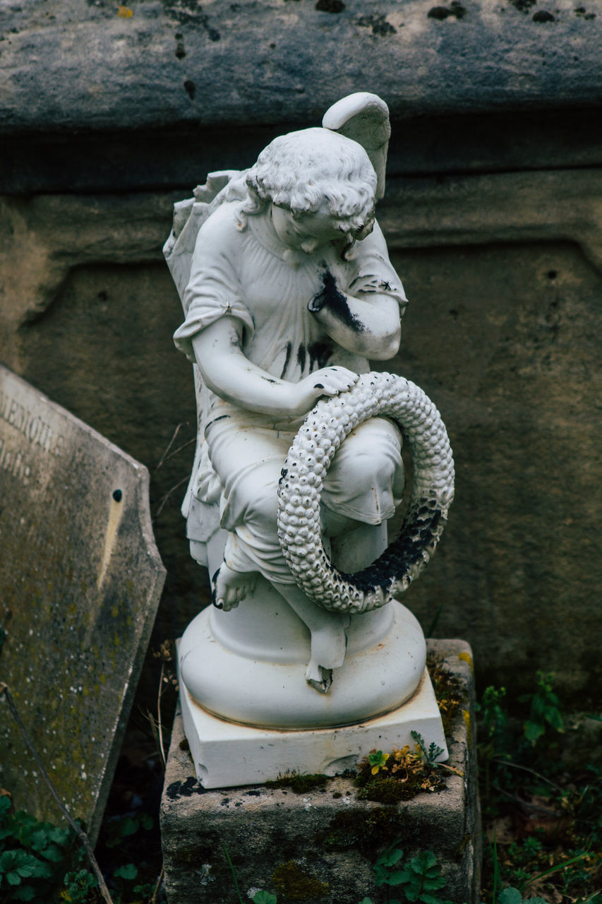 CLOSE-UP OF STATUE OF ANGEL