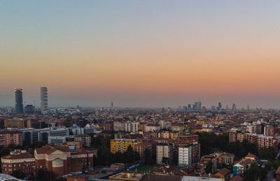 High angle view of buildings against sky during sunset