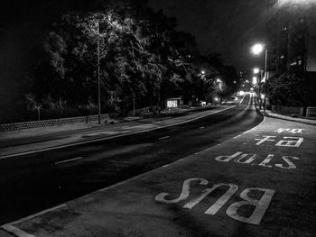 View of road sign at night