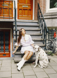 Portrait of young woman with dog