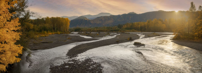 Nooksack river autumn sunrise. panoramc view of the nooksack river near deming, washington.