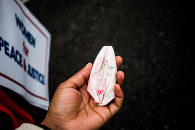 Close-up of man holding paper