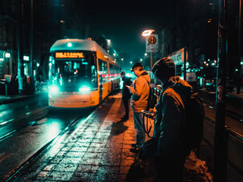 Men in city at night