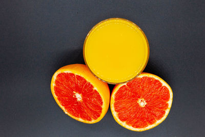 Directly above shot of orange slices against black background