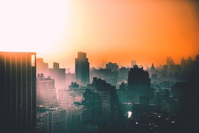 High angle view of cityscape against clear sky during sunset