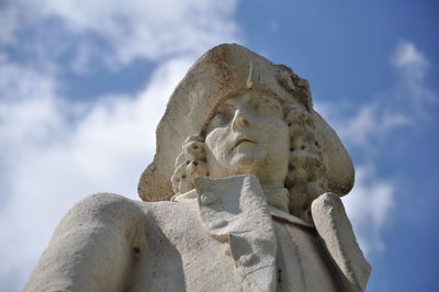 Low angle view of statue against sky