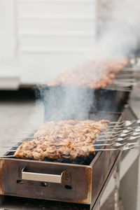 Close-up of meat on barbecue grill