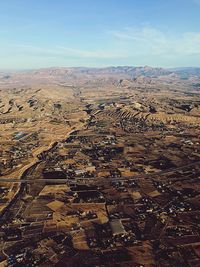 Aerial view of landscape against cloudy sky