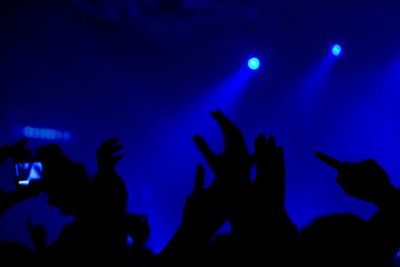 Rear view of people enjoying music concert