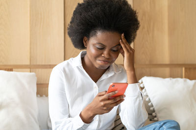 Young woman using mobile phone