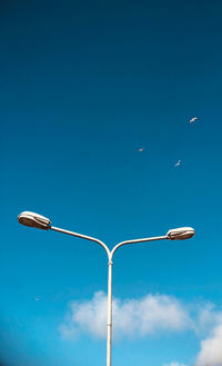 Low angle view of street light against sky