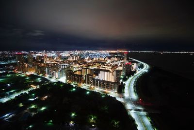 Aerial view of illuminated city at night