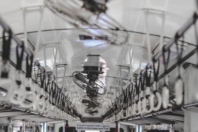 Low angle view of electric fans in train