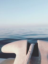 Close-up of rope on boat at sea against clear sky