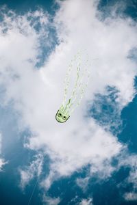 Low angle view of helicopter against sky